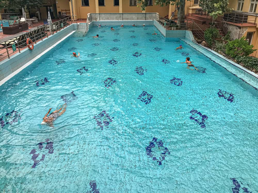 Incredibly calm vivid turquoise water cleanly revealing the sandy bottom below