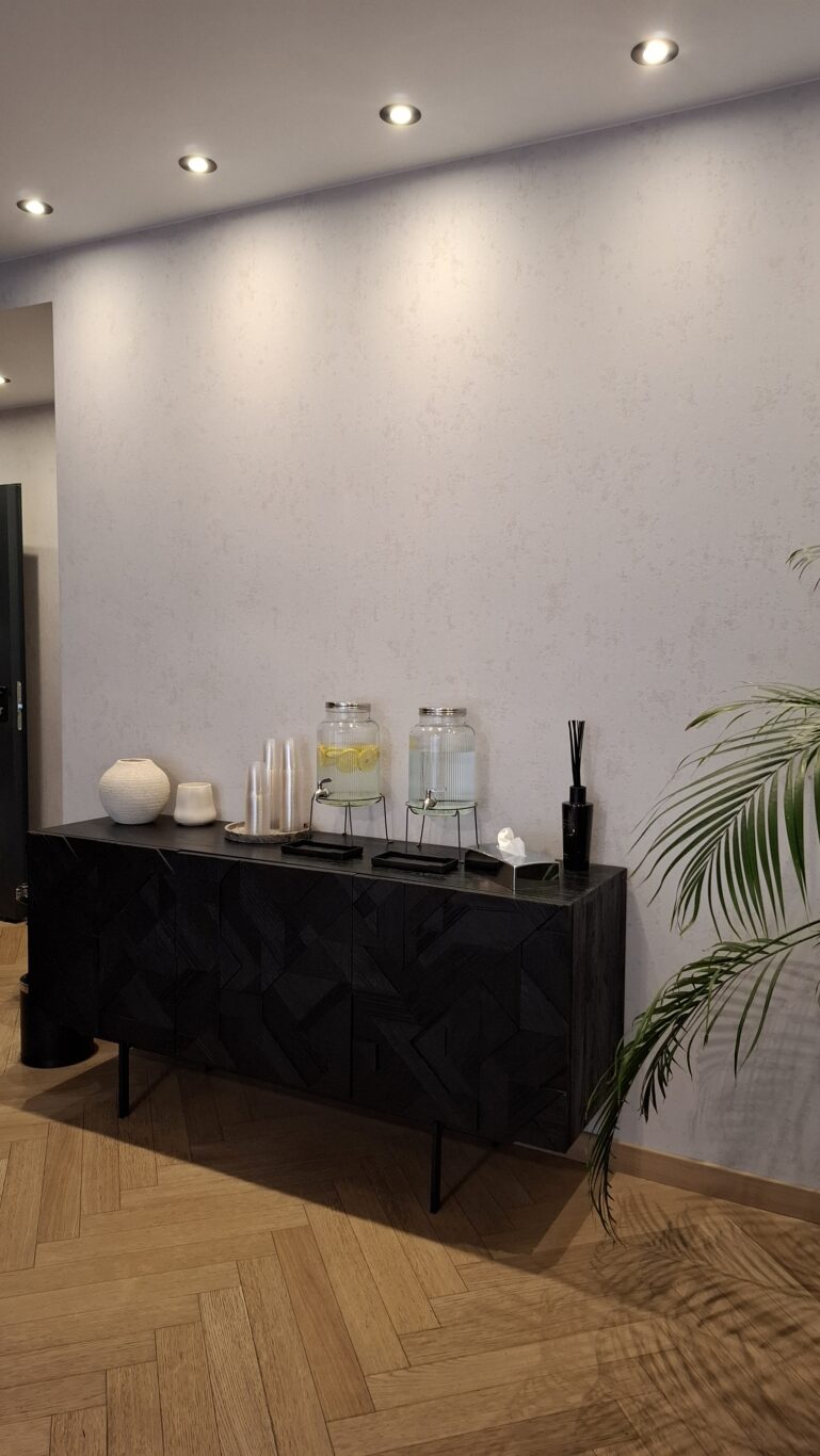 A vintage-inspired velvet armchair creating a cozy reading nook in the hotel room