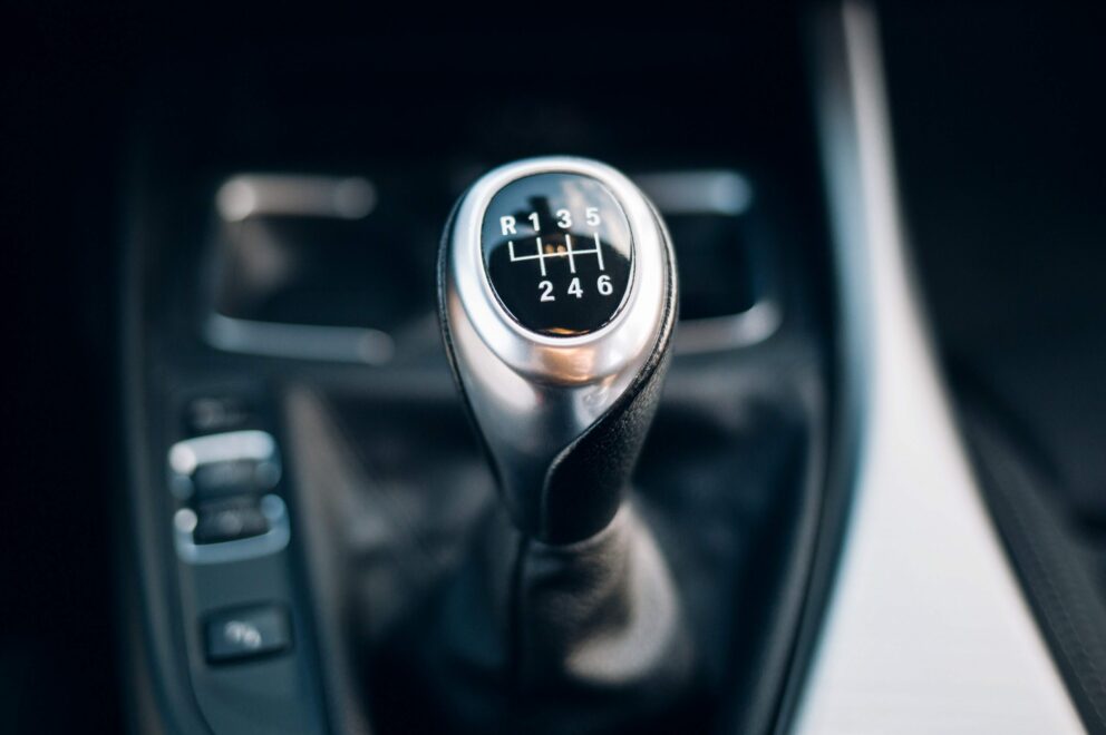 The stick shift of a standard manual transmission European rental car