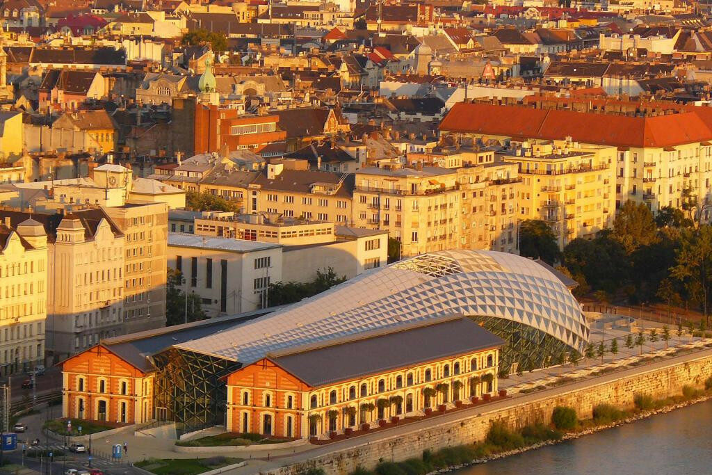 An aerial view showing the completely green teardrop shape of Margaret Island in the river