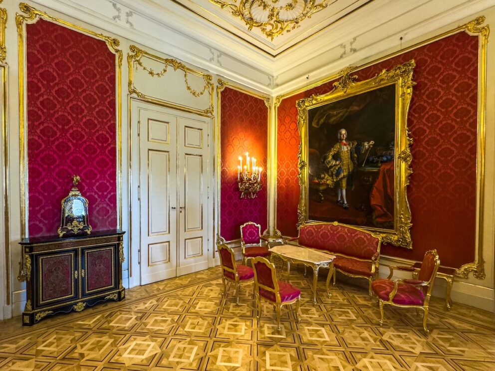 A large portrait of Empress Maria Theresa hanging in the Red Salon