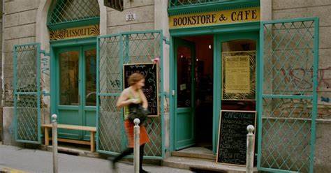 The turquoise green exterior of the Massolit Books and Cafe