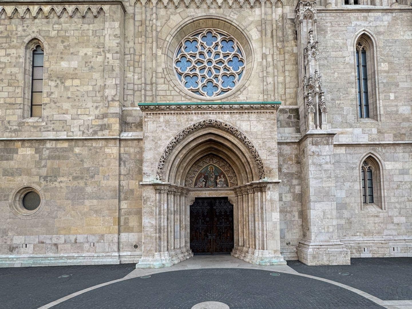 The ornately carved stone gothic entrance portal to Matthias Church