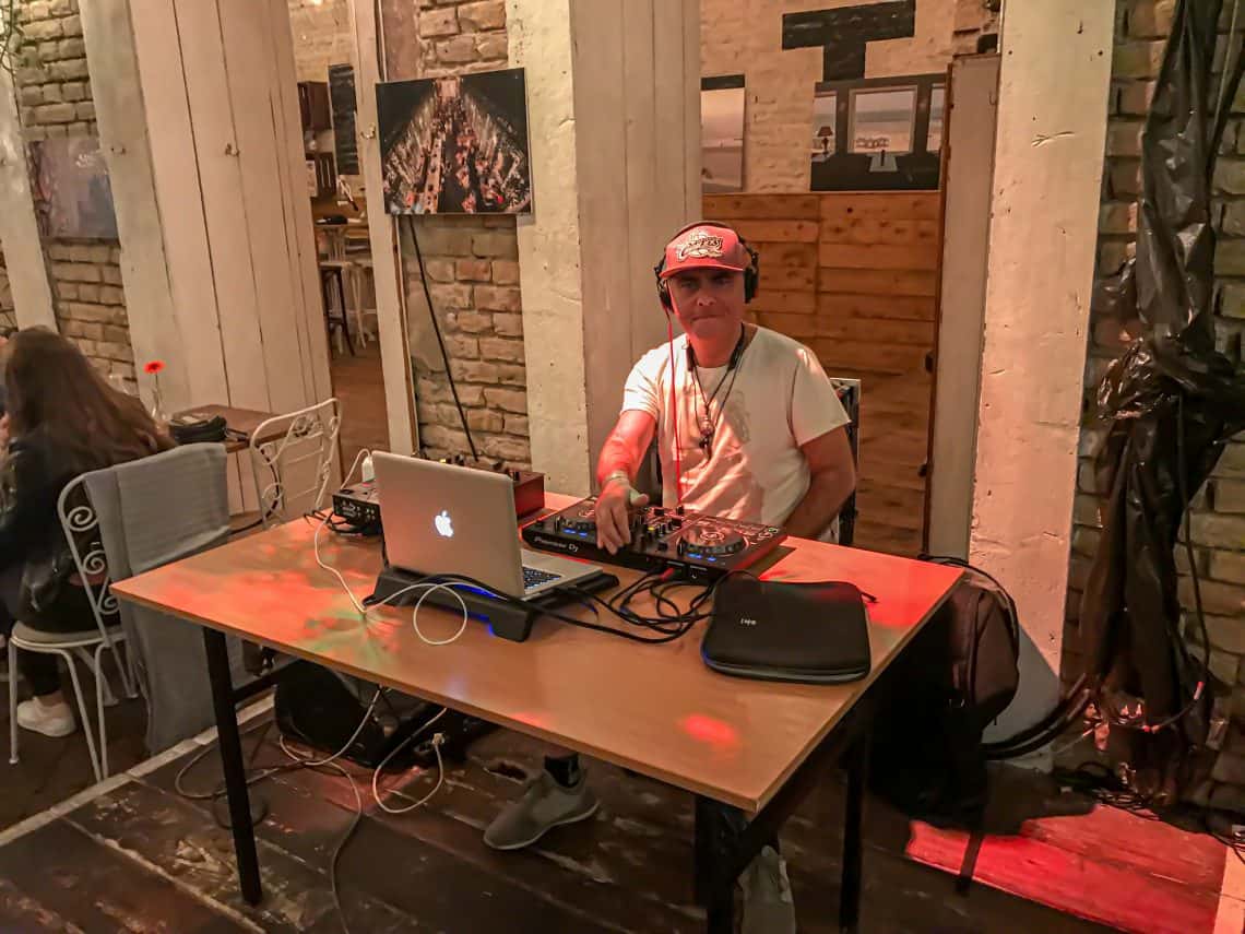 The warmly lit modern bar area securely serving signature craft cocktails