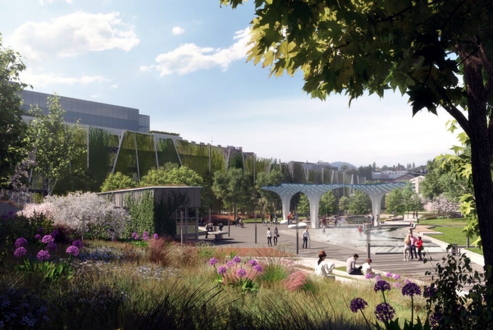 The modern brick exhibition halls surrounded by green parkland at Millenáris Park