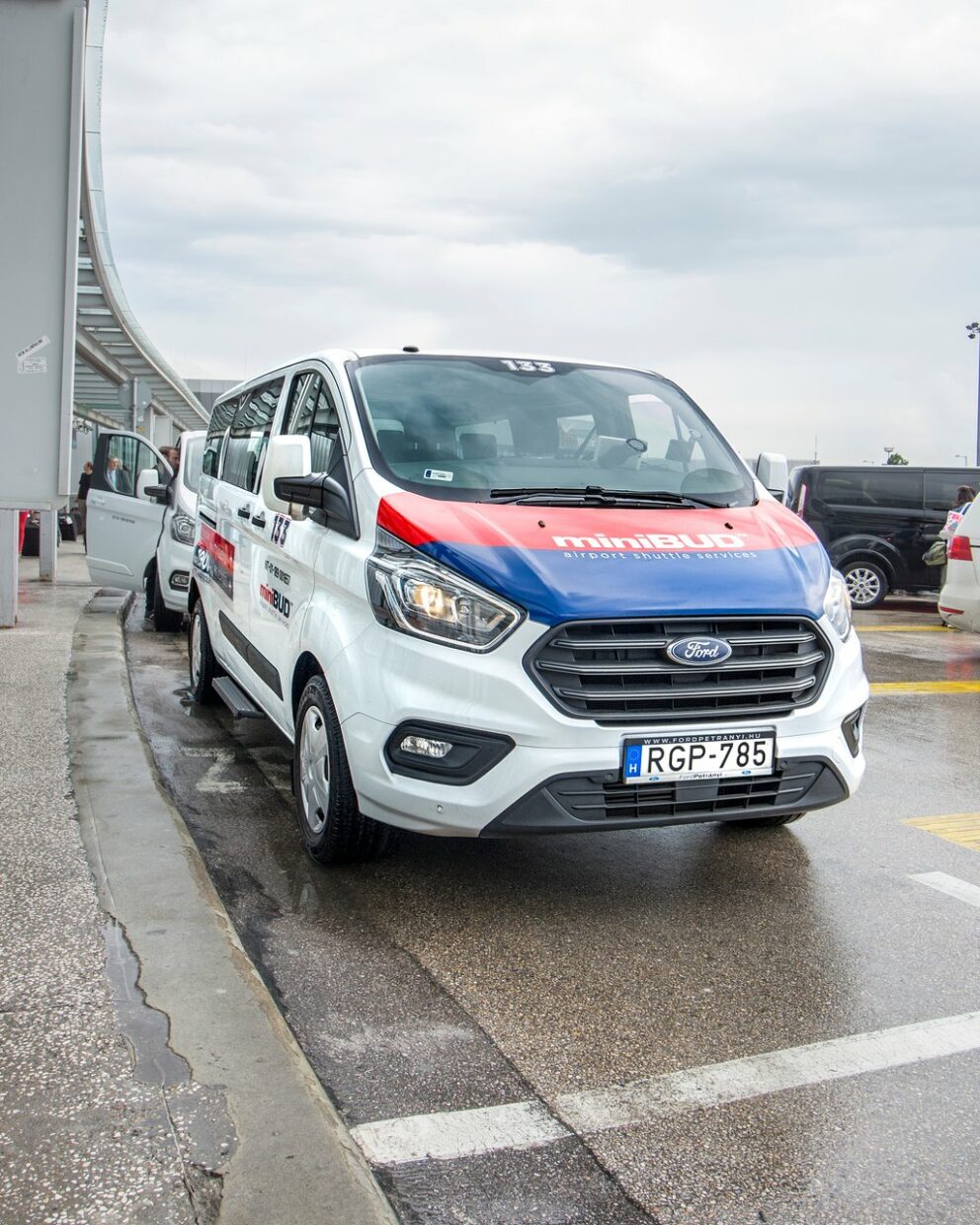 The official MiniBUD shared shuttle service van at Budapest Airport