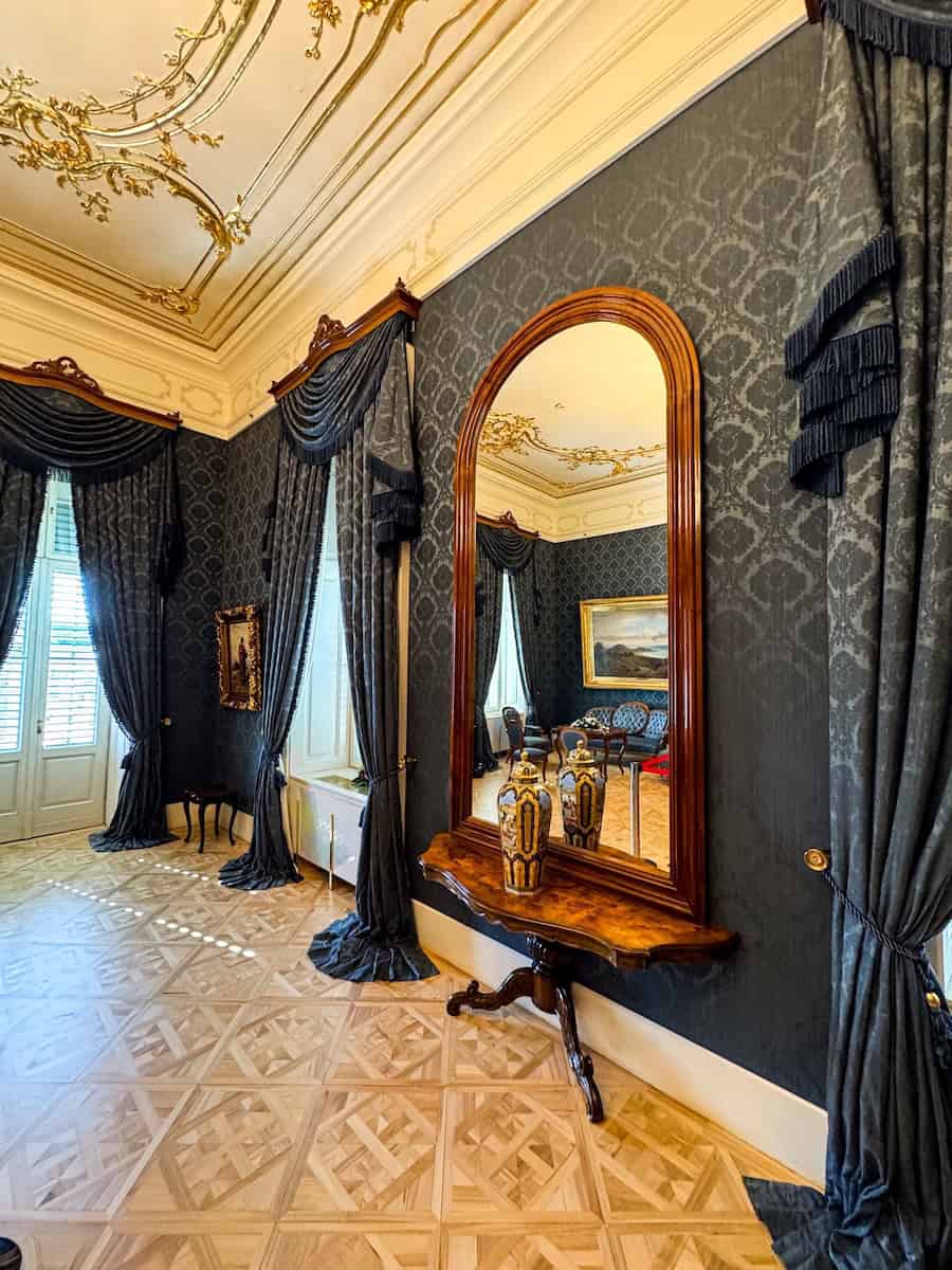 Facing mirrors creating an infinite reflection in the Blue Salon