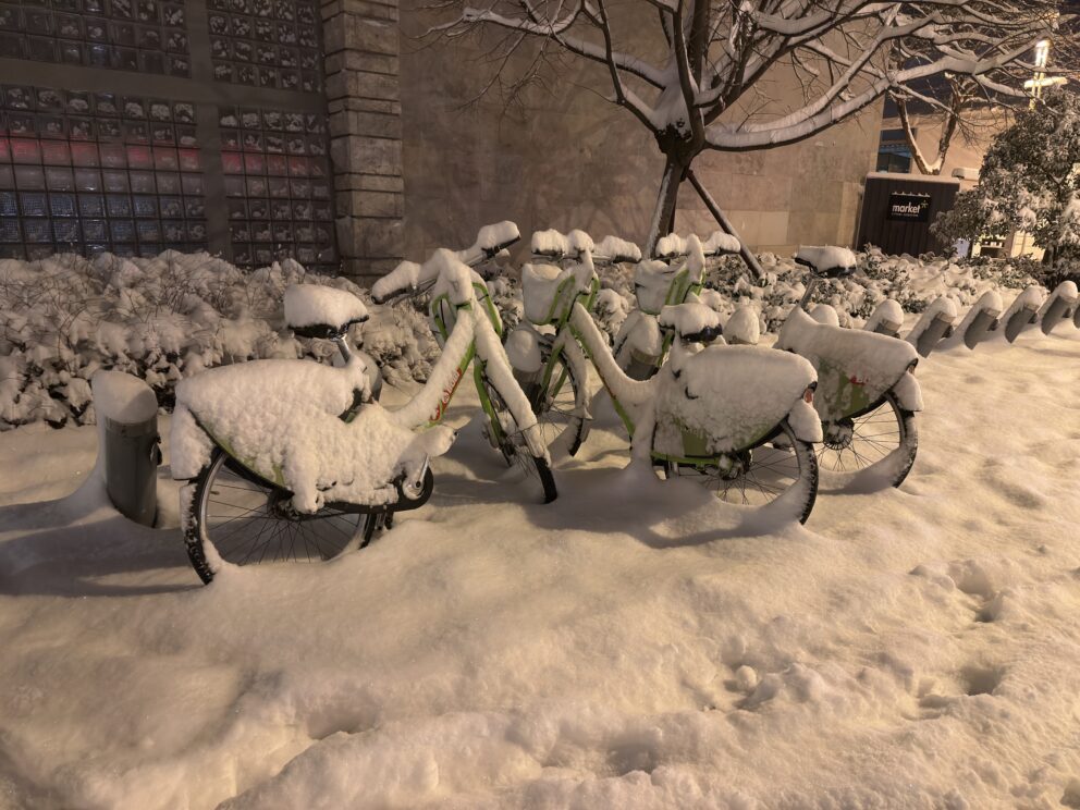 Public bicycles completely covered in deep snow after a winter storm in Budapest