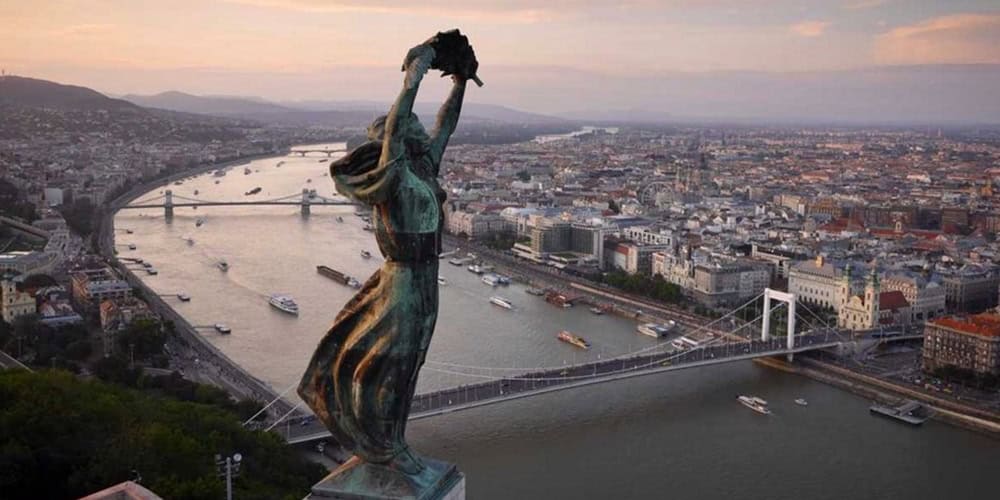The beautifully lit modern skyline of Budapest spanning both sides of the Danube
