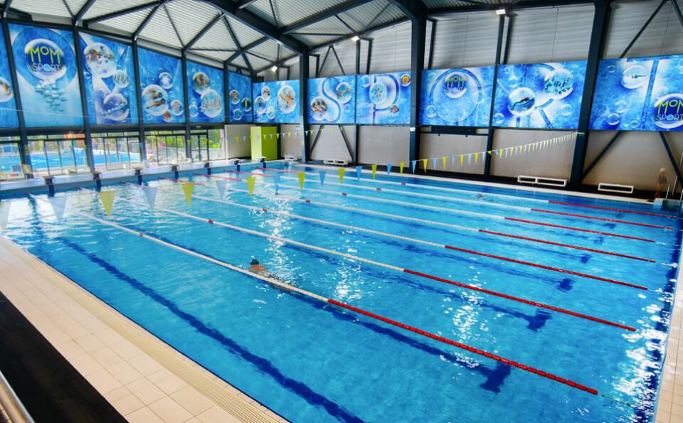 The pristine blue indoor lap pool at the MOM Sport complex