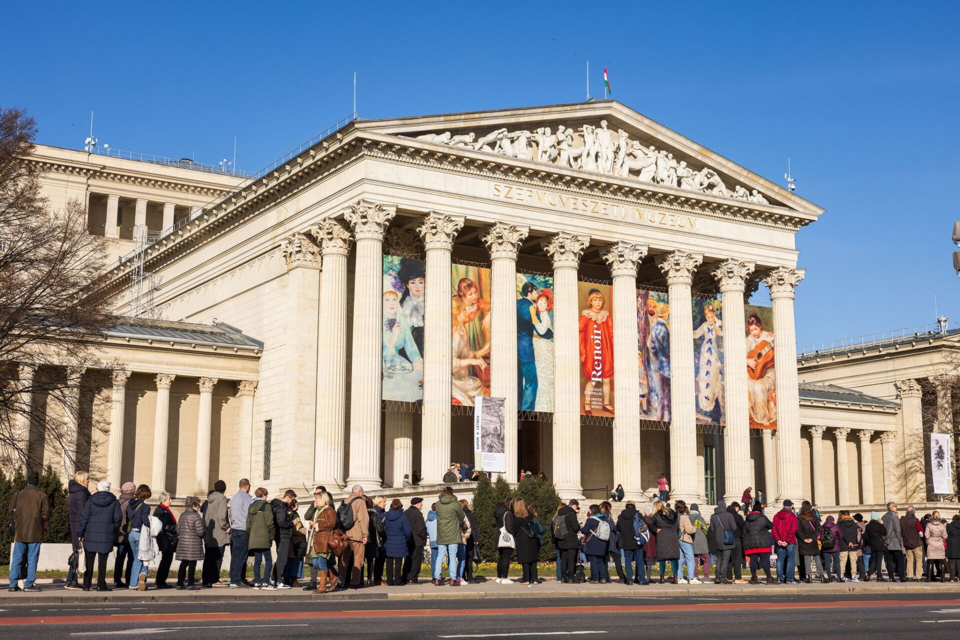 The magnificent classical facade of the Museum of Fine Arts featuring massive stone Corinthian columns at Heroes' Square