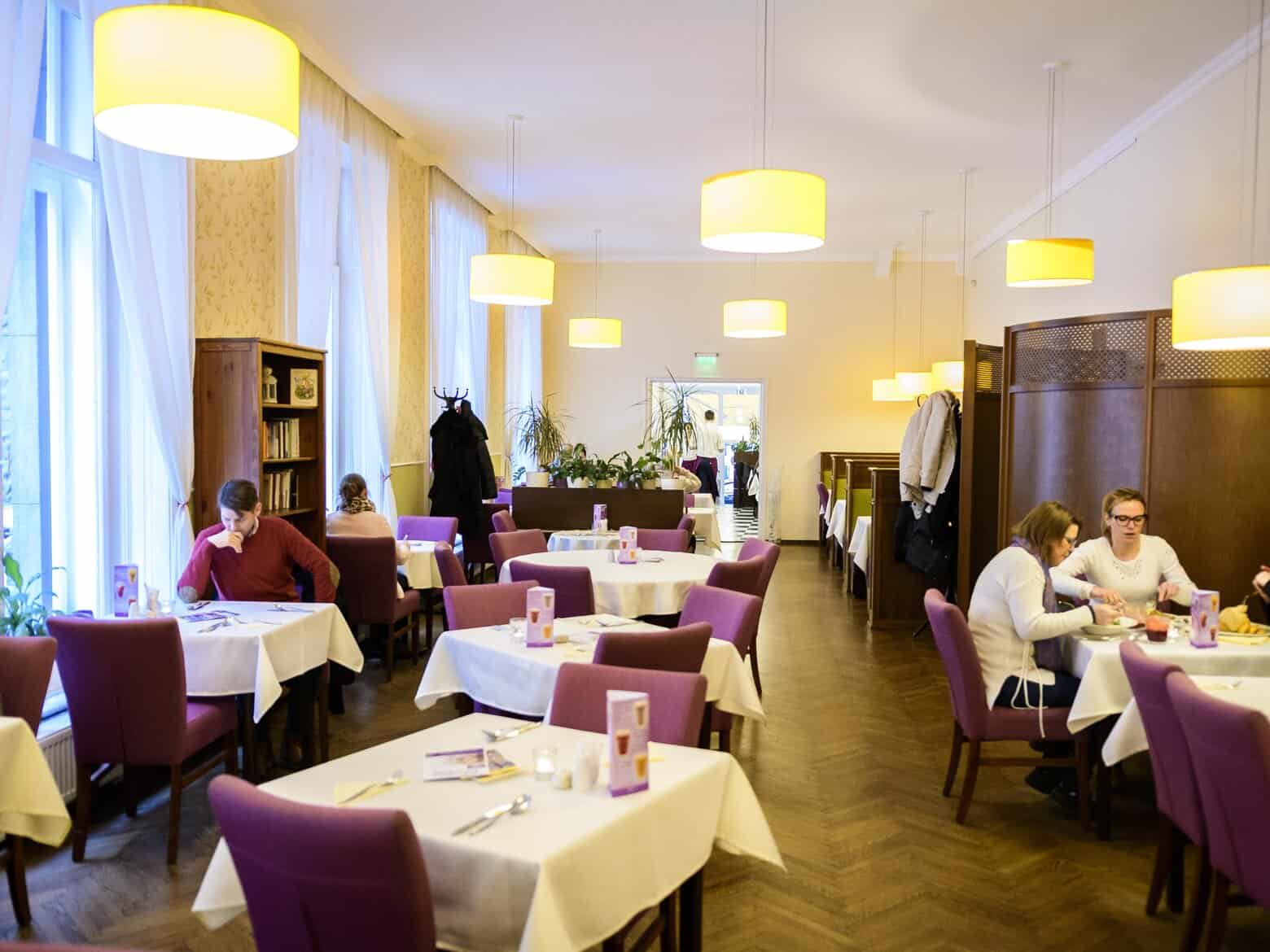 The bright and modern dining room of Napfenyes Restaurant