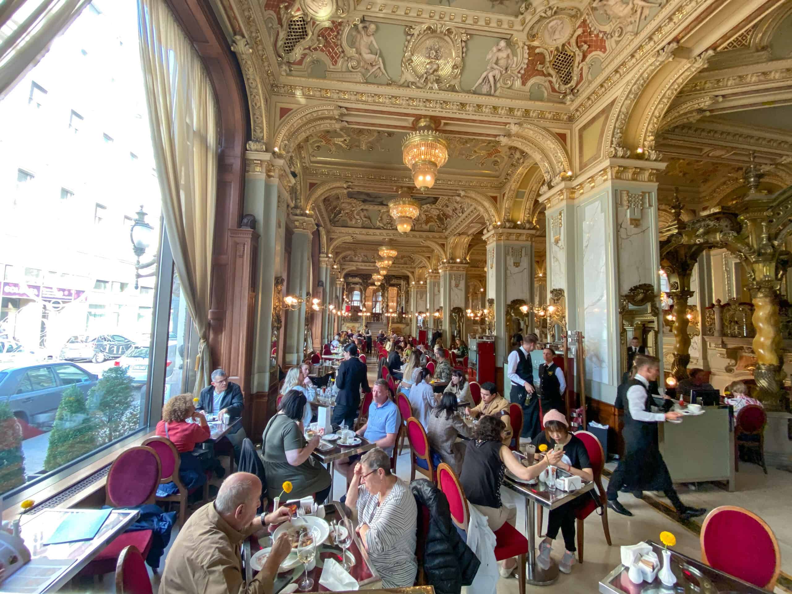 The breathtaking gold ceilings, frescoes, and elegant pillars inside the historic New York Café