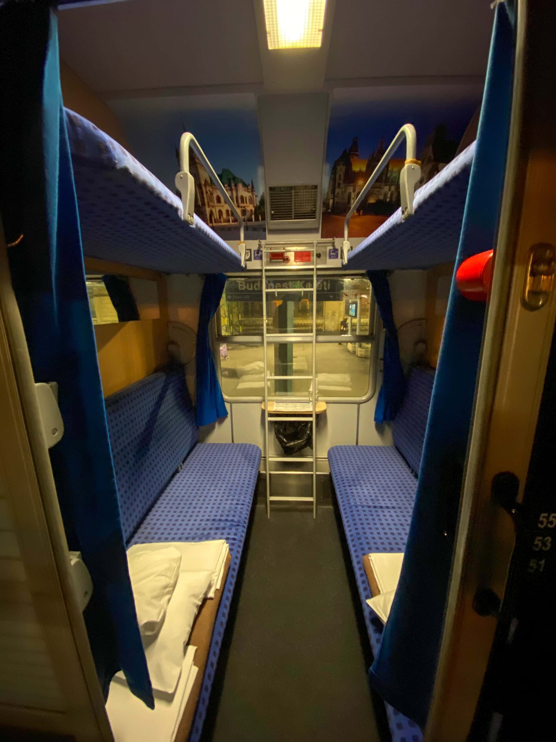 The narrow wooden corridor of the EuroNight sleeper train carriage