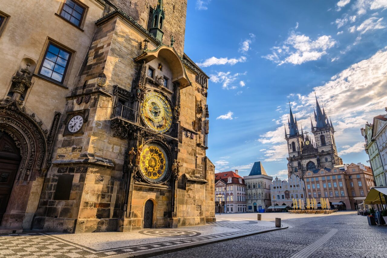 The bustling Old Town Square featuring the gothic spires of Týn Church in Prague