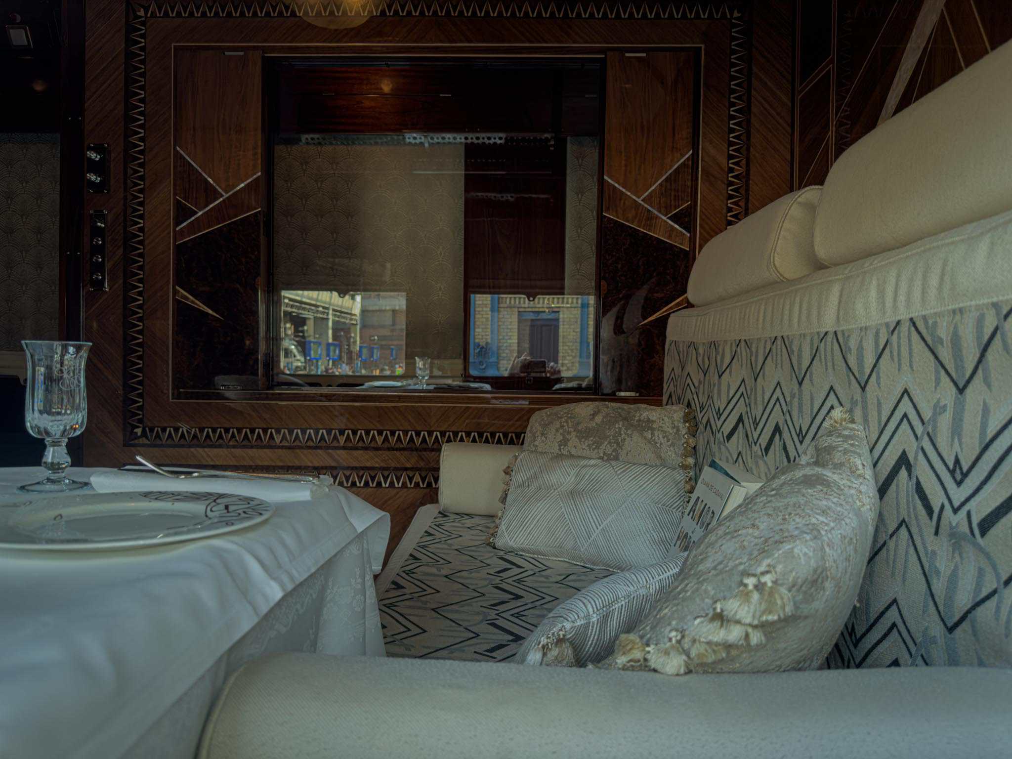 A luxurious private sleeper cabin interior on the Orient Express
