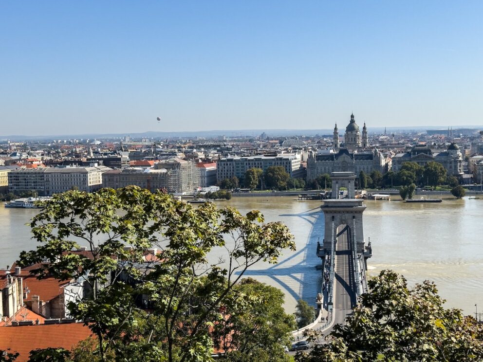 A wide hazy afternoon view of the city from the palace terrace