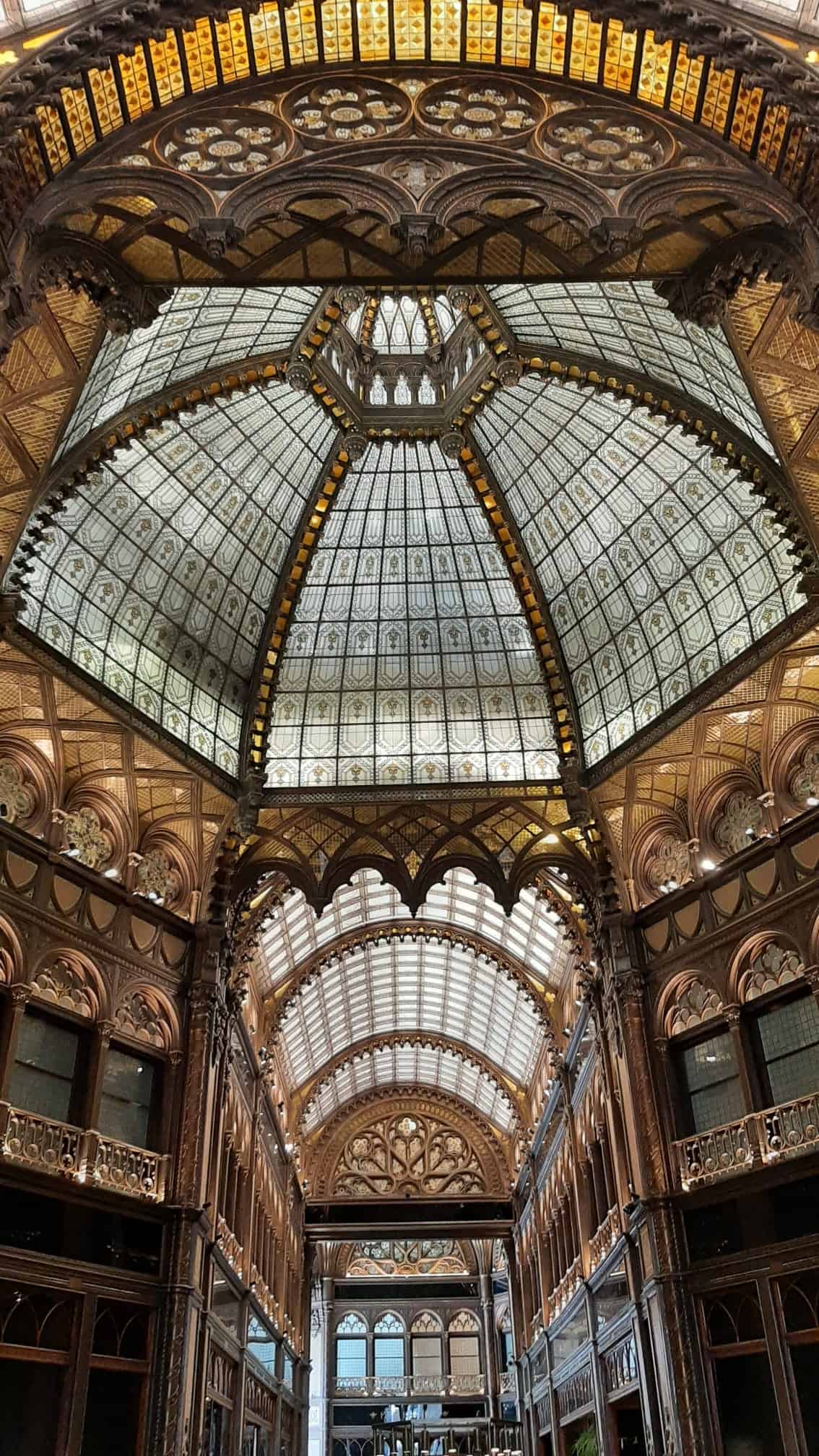 The astonishingly detailed wonderfully ornate gothic-moorish tiled ceiling of the luxurious arcade