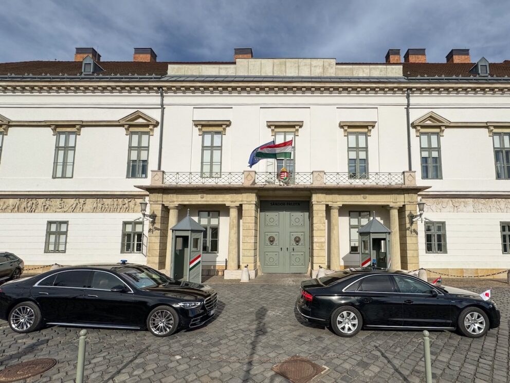 A car parked in the historic Buda Castle District near Sándor Palace