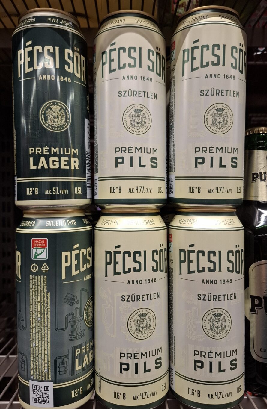 A green glass bottle and a full glass of Pécsi Sör Premium Lager