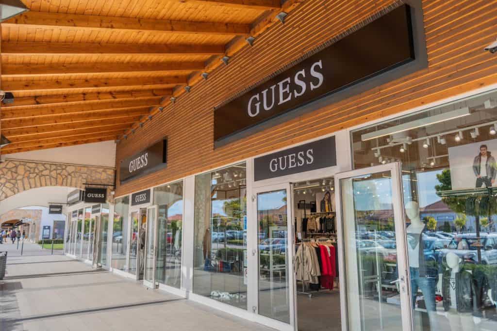 Colorful storefronts and brand logos displayed proudly at the Premier Outlet in Budapest
