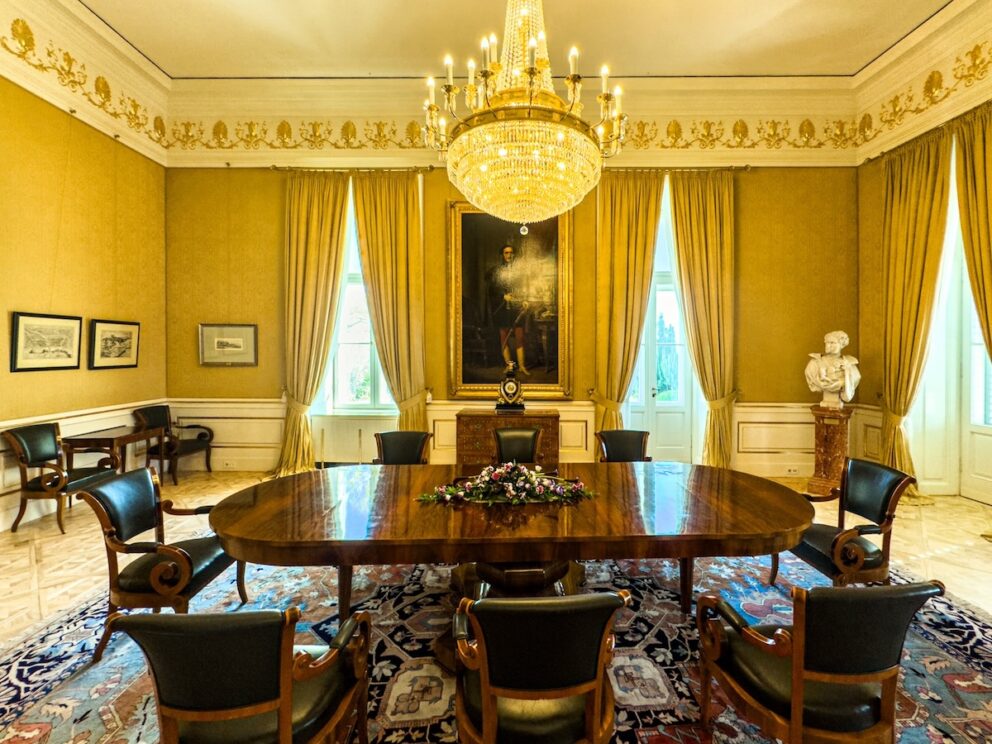 The formal conference room with a long table inside the presidential palace
