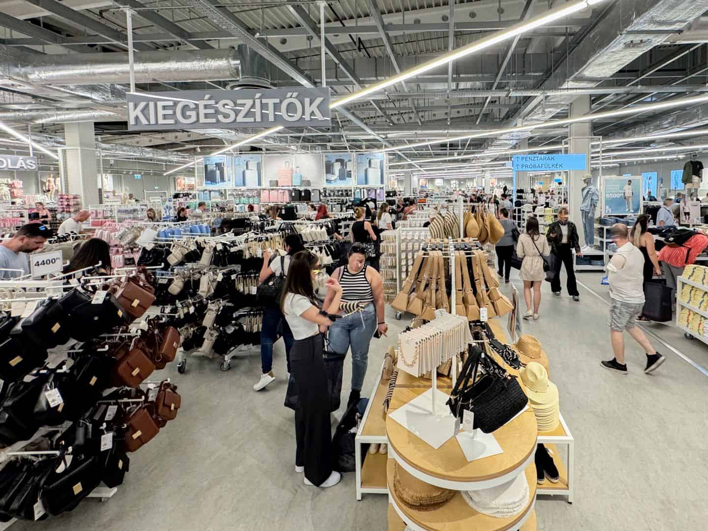 A wide variety of affordable handbags displayed in the Primark accessories section