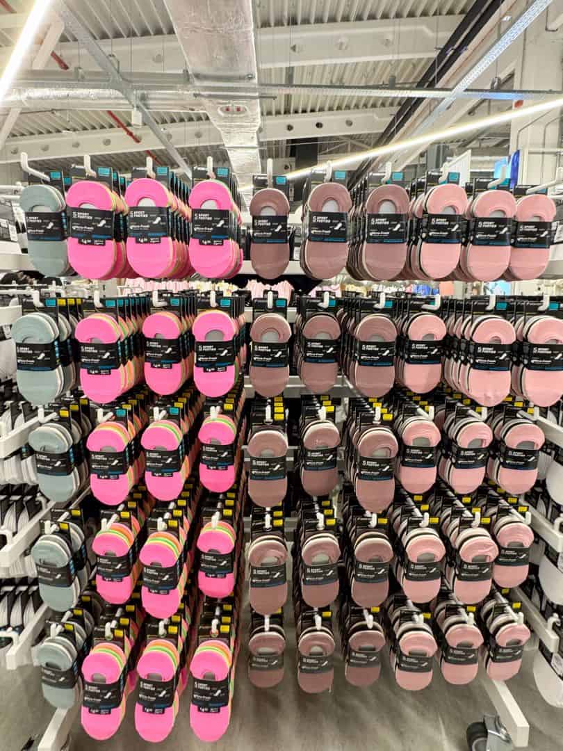A massive, perfectly organized wall displaying multi-packs of pastel ankle socks