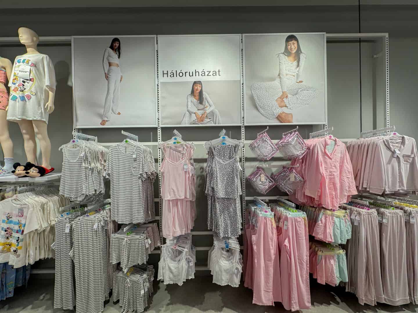 Displays of matching pastel pink and grey pajama sets in the sleepwear section