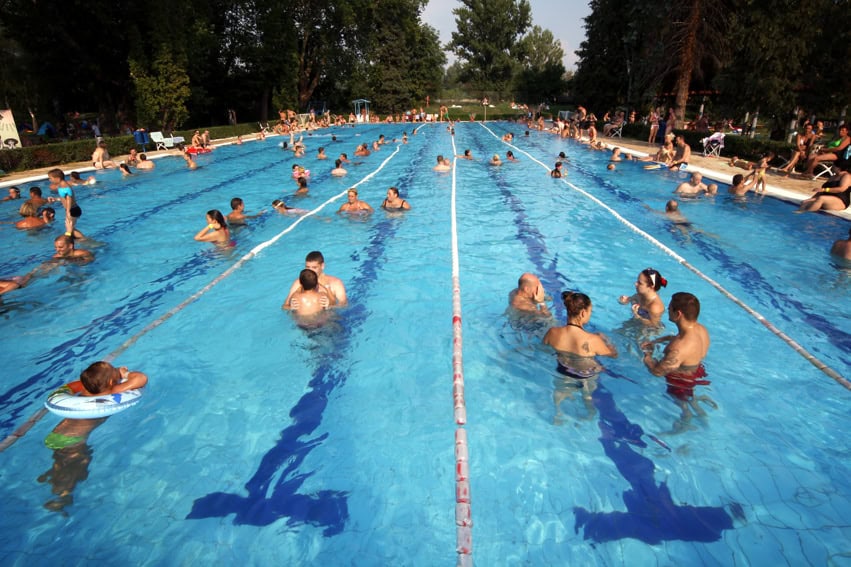 Swimmers in the 50-meter outdoor swimming pool at Punkosdfurdo Bath