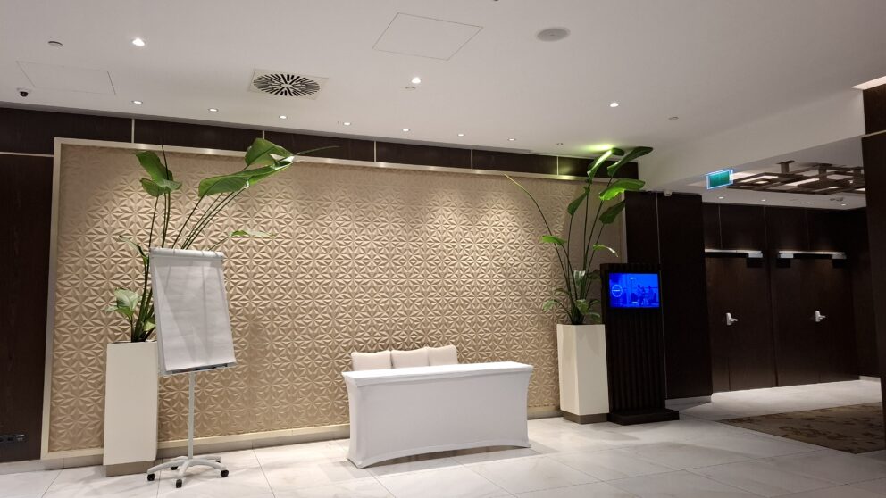 A modern event space and registration area inside the hotel