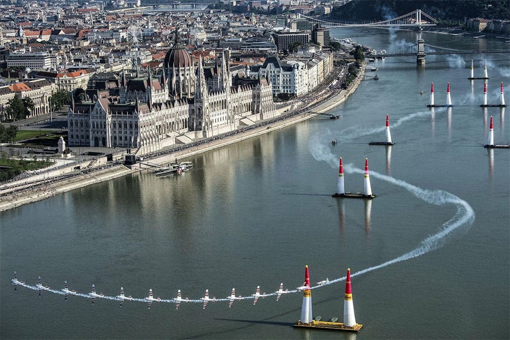 Stunt plane flying over the Danube during the Red Bull Air Race in Budapest
