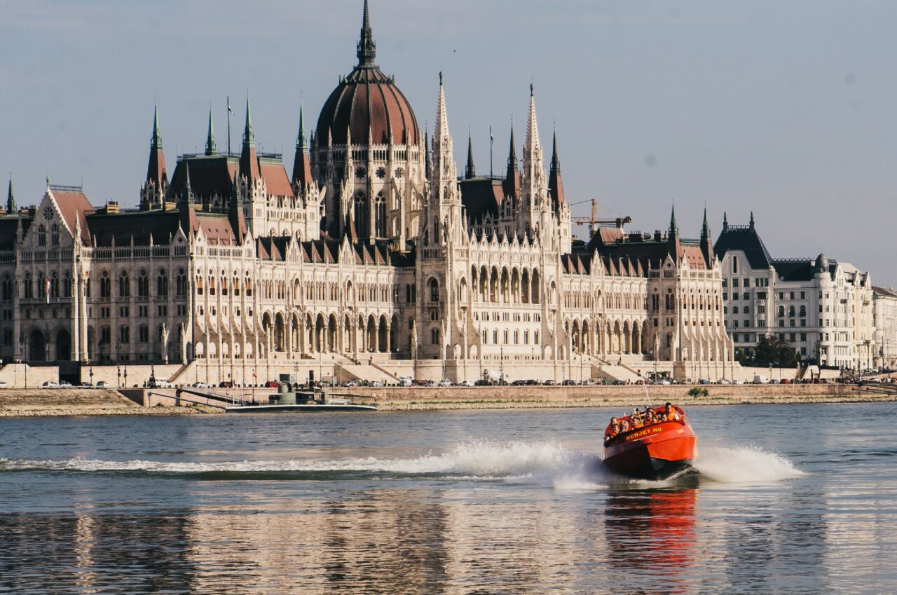 Tourists enjoying a fast boat ride on the Danube in front of the Parliament