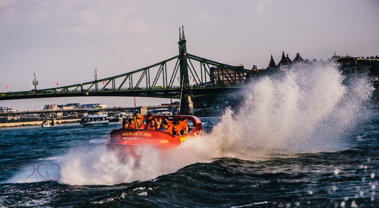 The RedJet boat performing a sharp spinning maneuver and splashing water