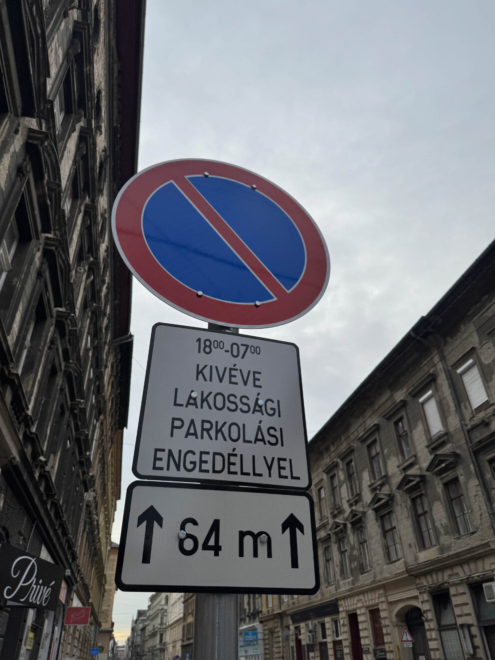 A street sign indicating parking is restricted except for vehicles with a residential parking permit