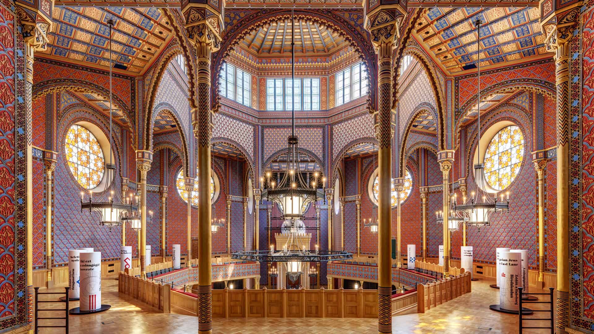 The breathtakingly ornate interior and colorful octagonal dome of the Rumbach Street Synagogue