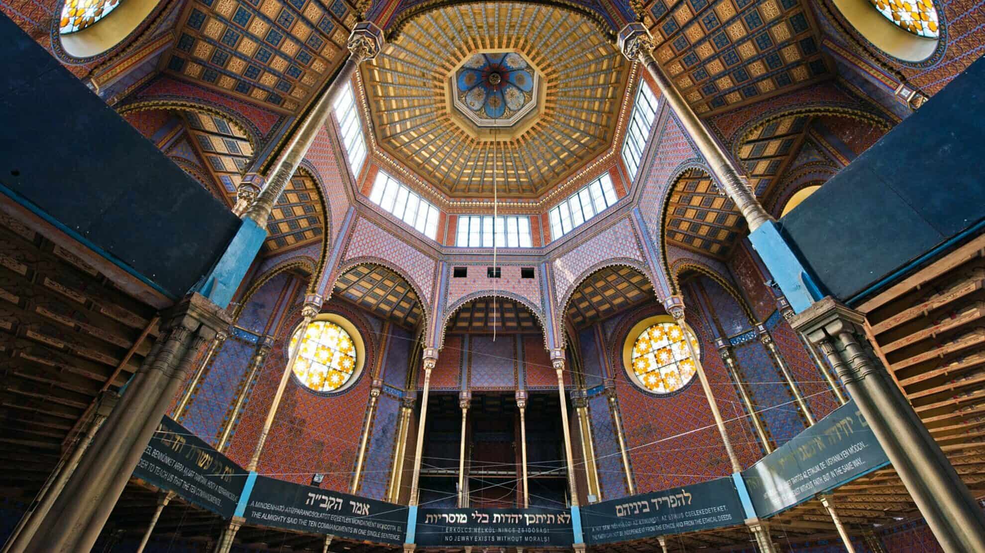 Looking up into the spectacular patterned octagonal dome of the Rumbach Synagogue