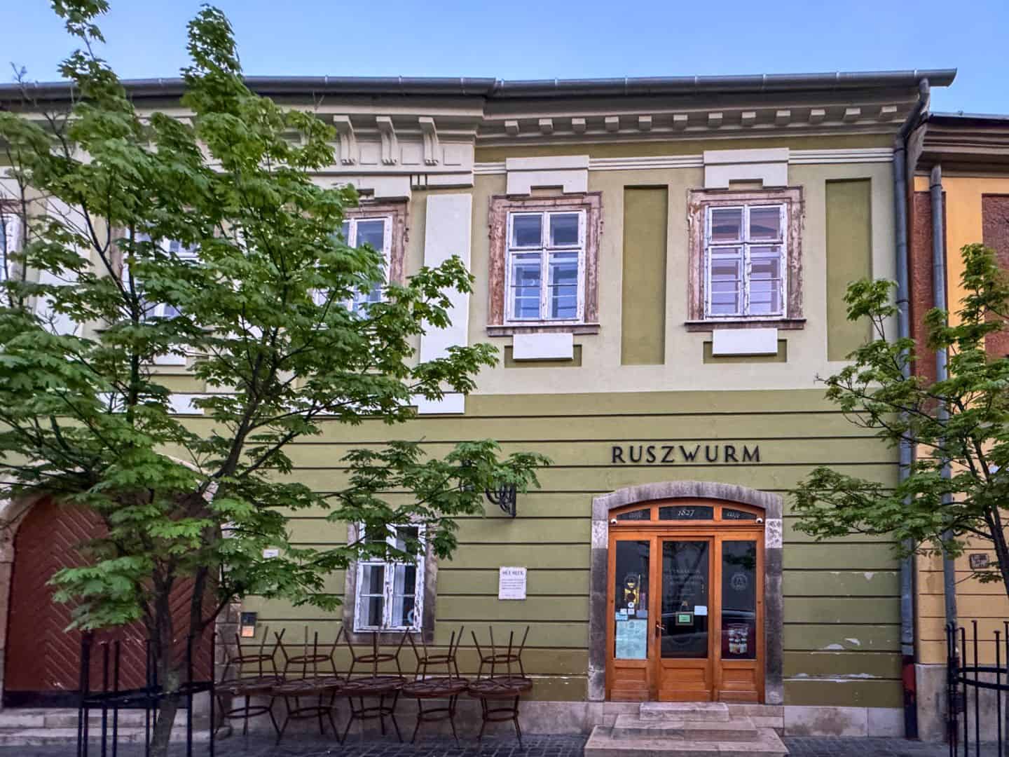 The vintage storefront and signage of the historic Ruszwurm Confectionery