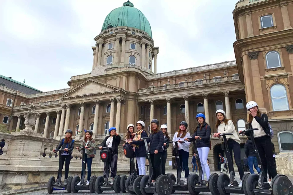 A Segway tour group lined up on the square directly in front of Parliament