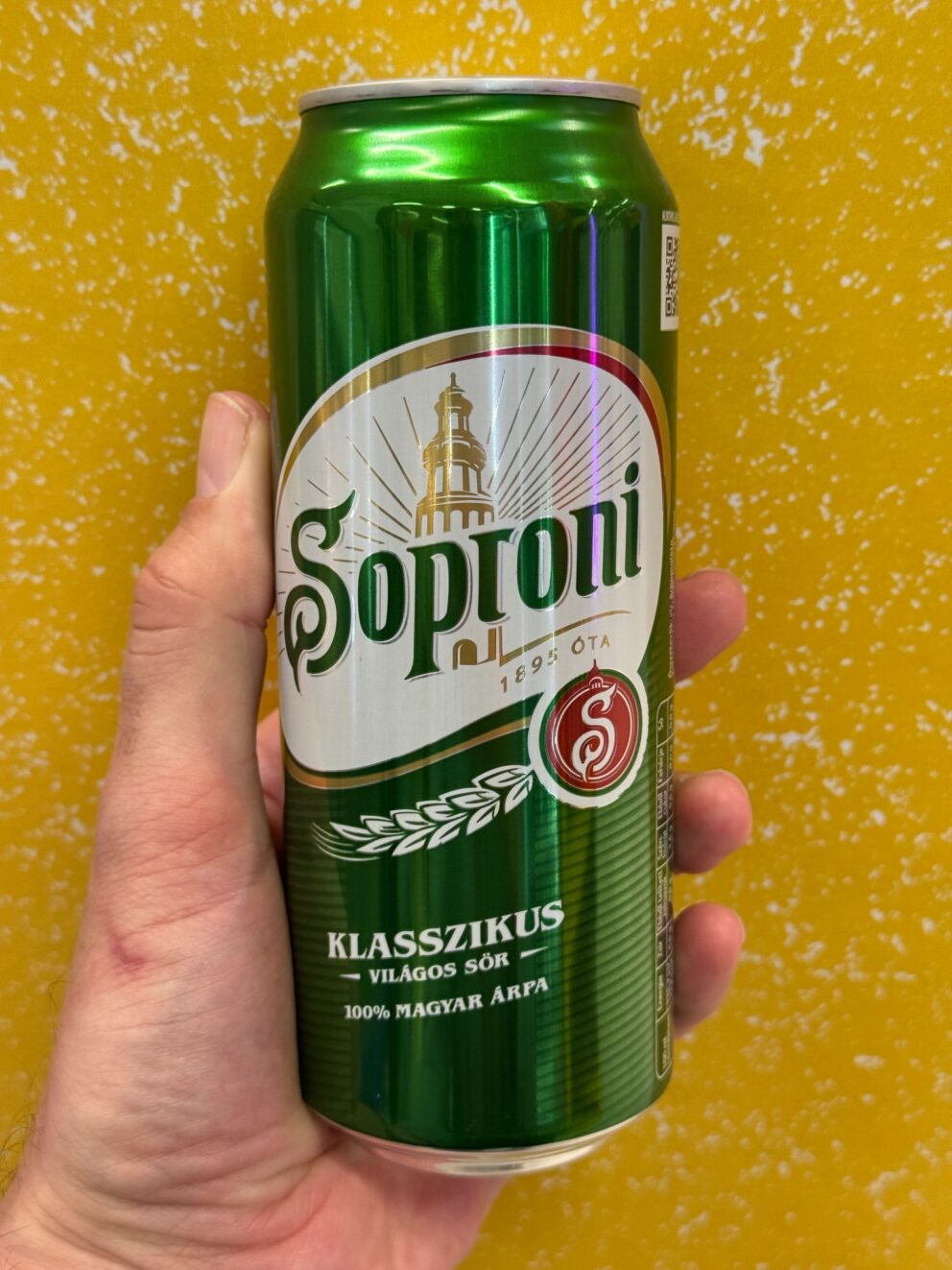 A perfectly poured, heavily carbonated pint of Soproni draft beer