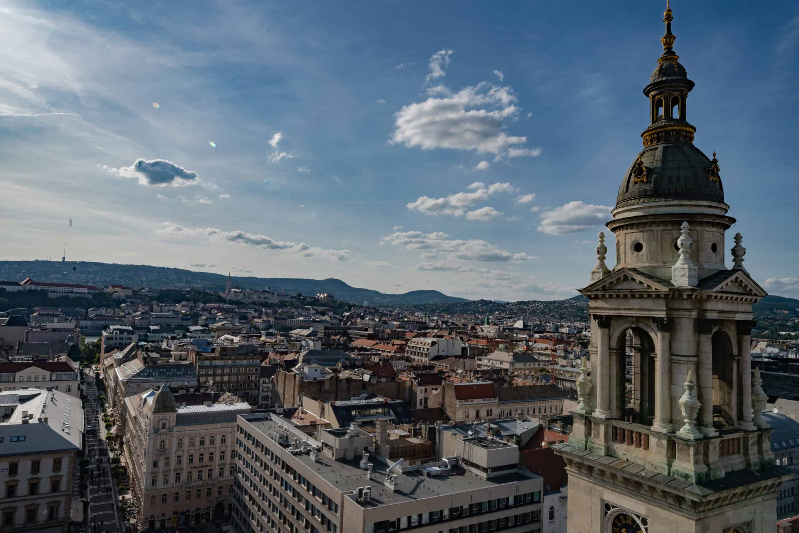 The massive dome and classical stone pillars of St. Stephen's Basilica dominating the pedestrian square