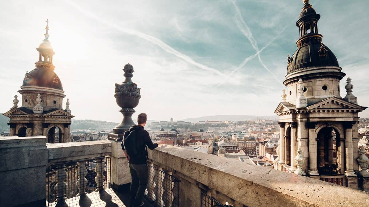 A visitor enjoying the panoramic cityscape view from the Basilica dome lookout