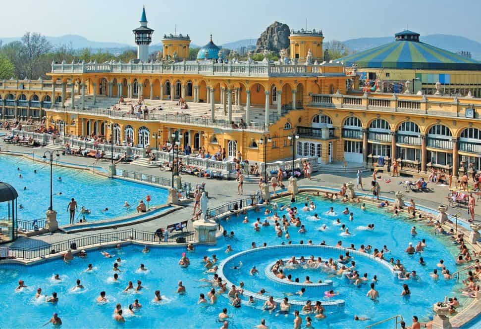 Sunny day at the bustling outdoor thermal pools of Szechenyi Bath