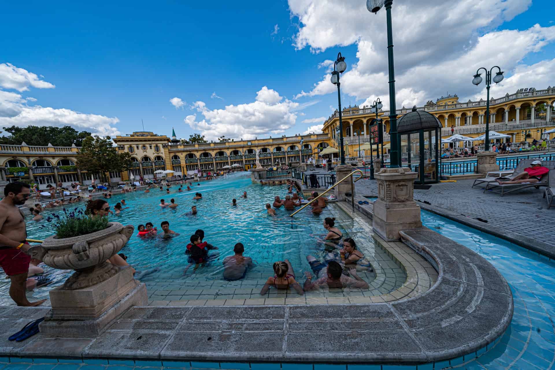 Crowds relaxing in the warm outdoor thermal pool at Szechenyi