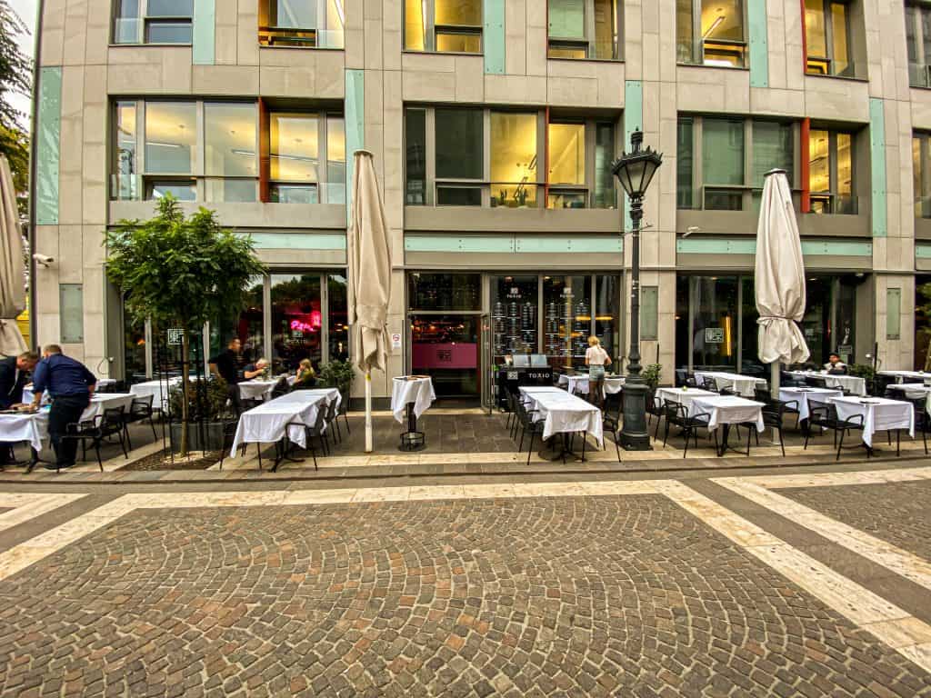 The outdoor terrace of TOKIO restaurant covered with white tablecloths