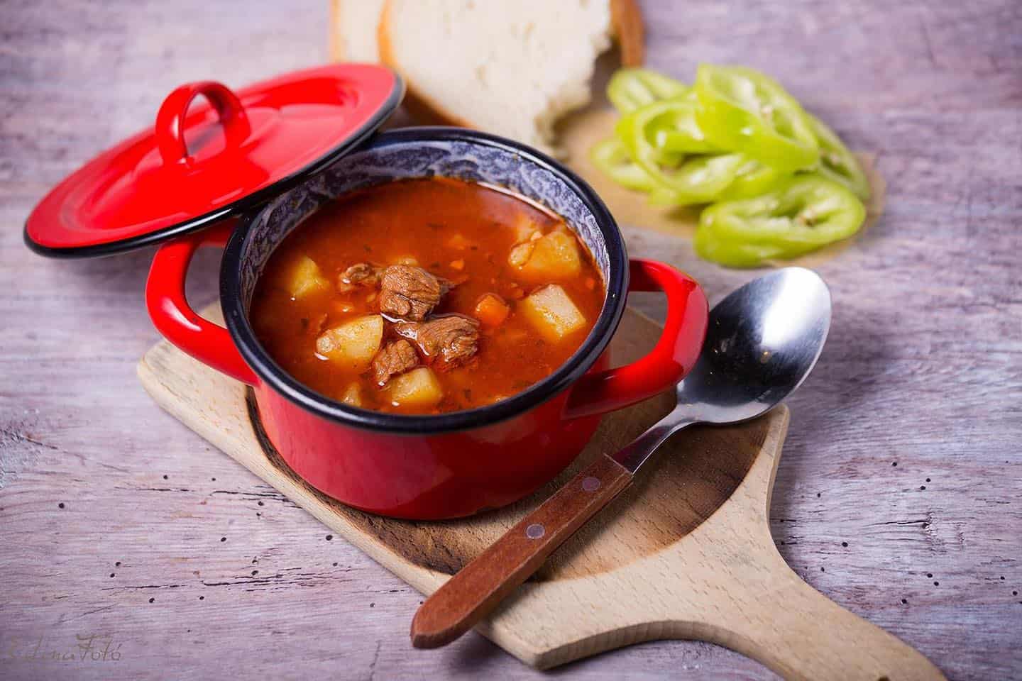Traditional Hungarian Goulash Soup served in a red pot