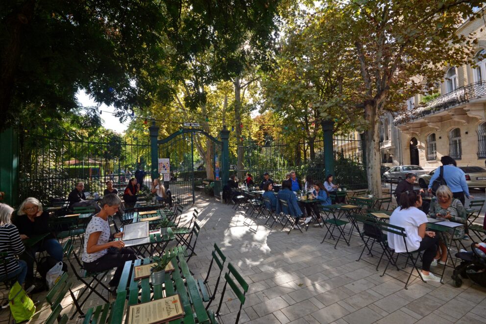 A massive, bizarre chandelier made of repurposed junk hanging from the ceiling