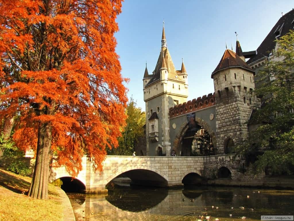 The highly romantic, eclectic towers of Vajdahunyad Castle reflecting in the City Park lake