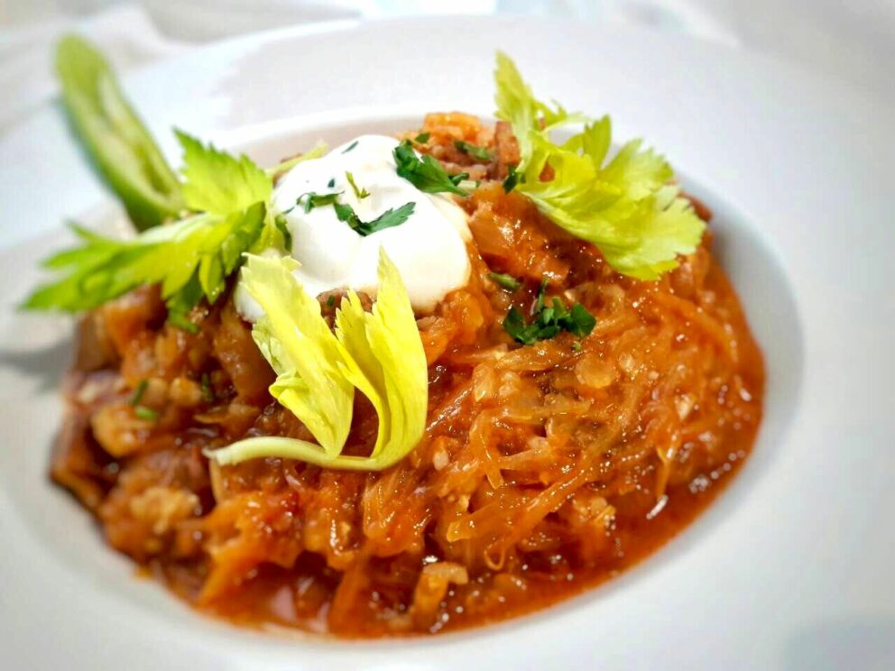 Vegan Hungarian Stuffed Cabbage served with plant-based sour cream