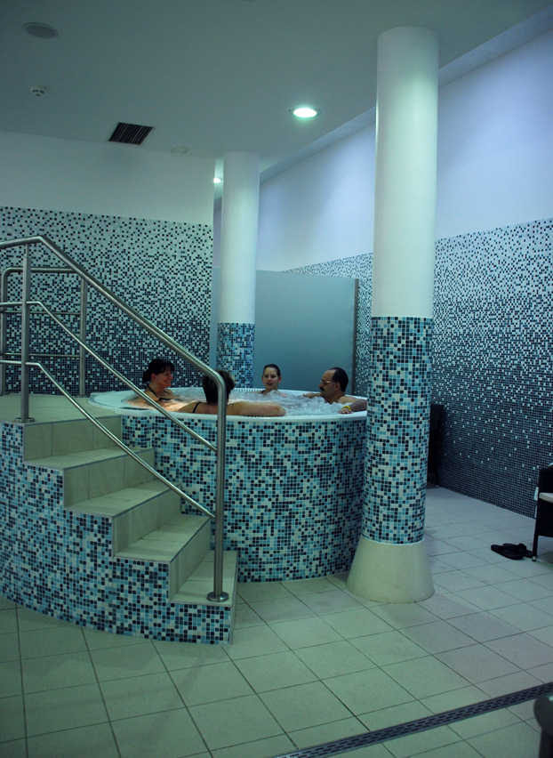 Visitors relaxing in the mosaic jacuzzi at Veli Bej